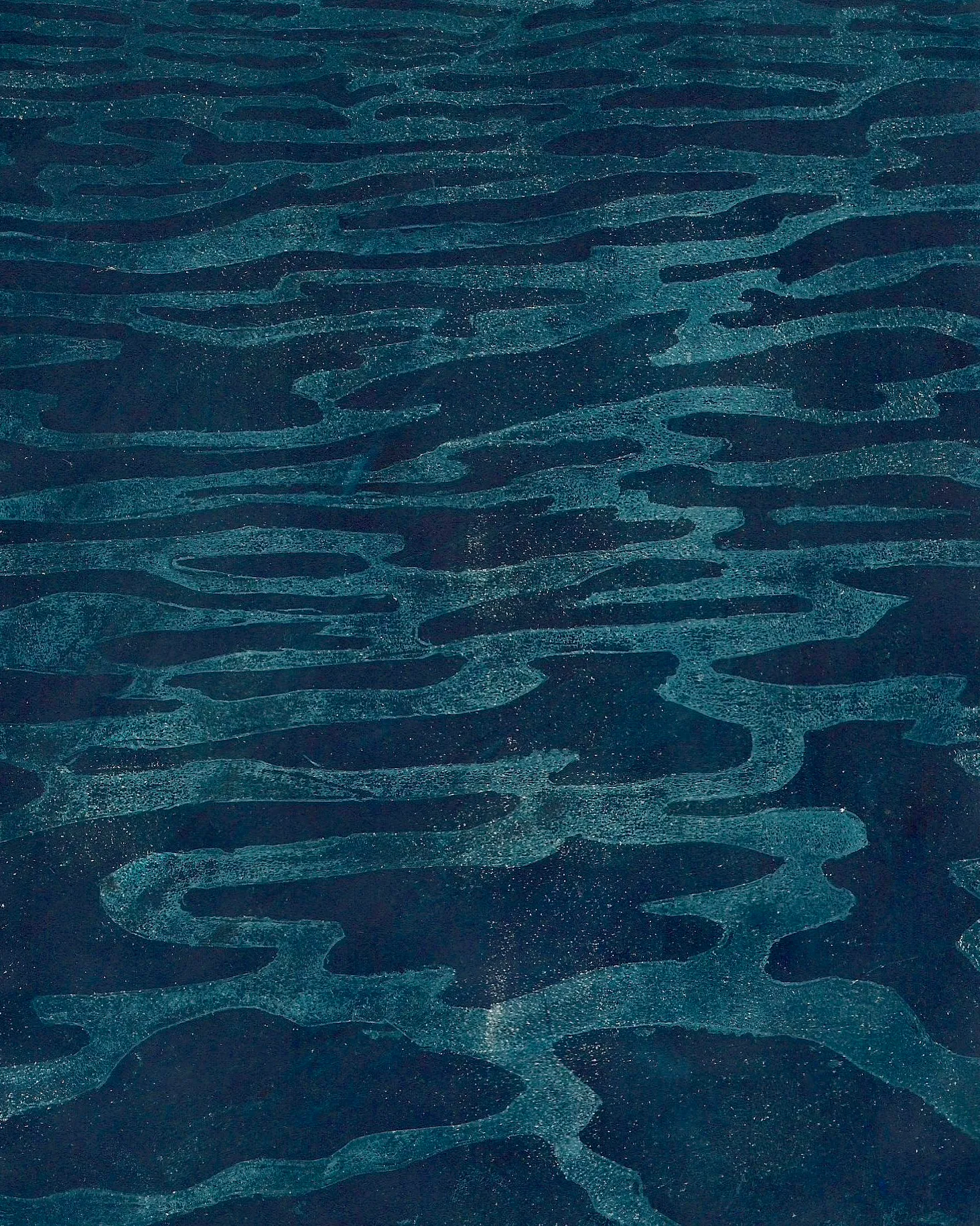 Deep navy-teal ground with pale ripple-like horizontal striations and fine light speckling throughout.